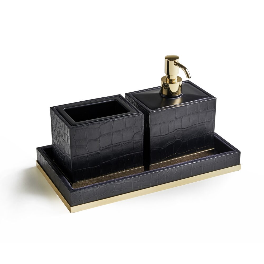 Accesorios de baño elegantes en negro y dorado.