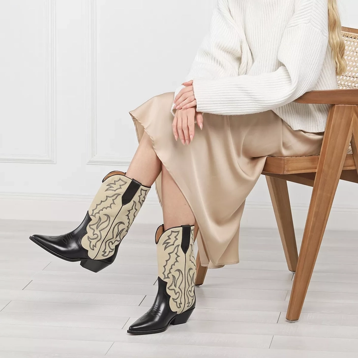 Las botas de invierno de mujer más de moda, botas cowboy.